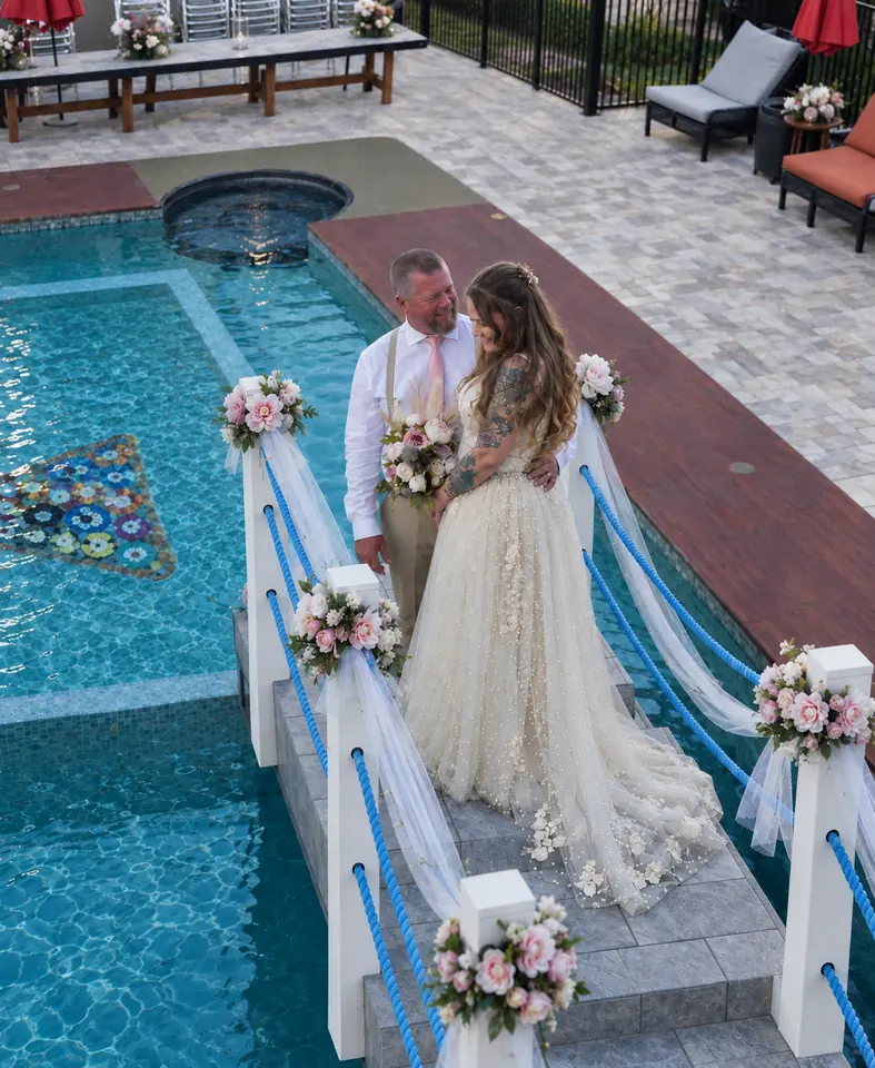 The newlyweds on the pool bridge, seen from above