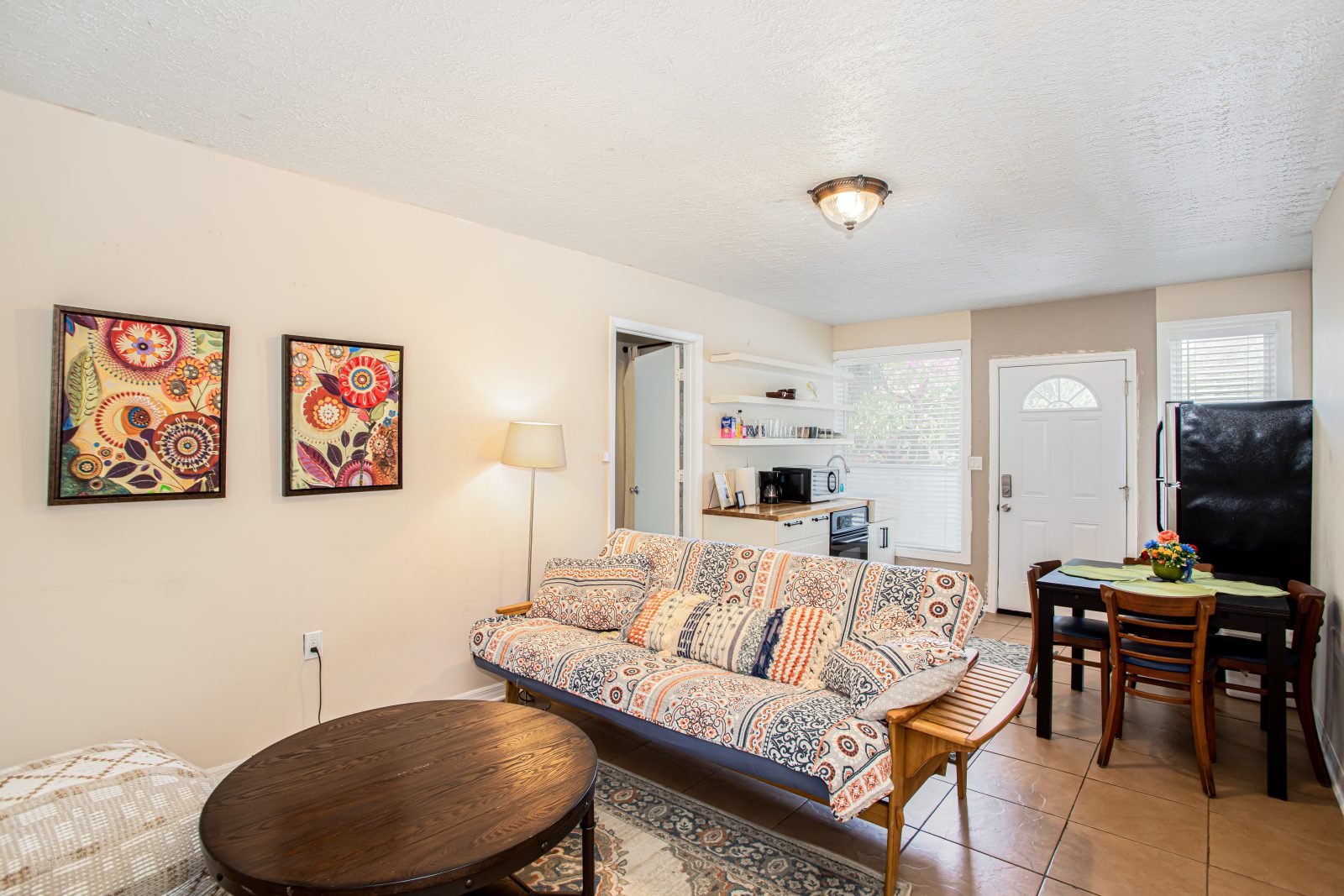 Kick back on the futon sofa in a sunny open living room.