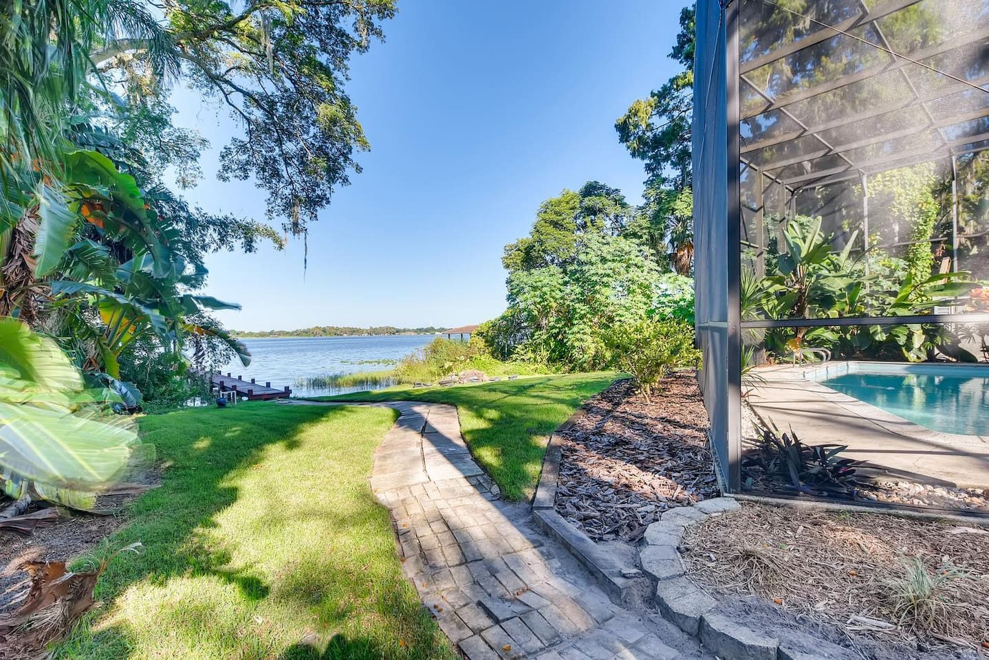 Tee off on your own backyard putting green by the water.