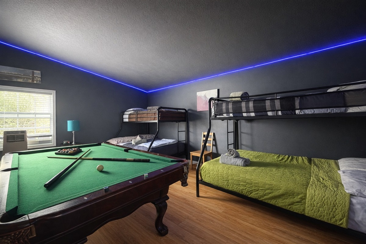 Shoot pool and bunk the crew in the bright Game Room.
