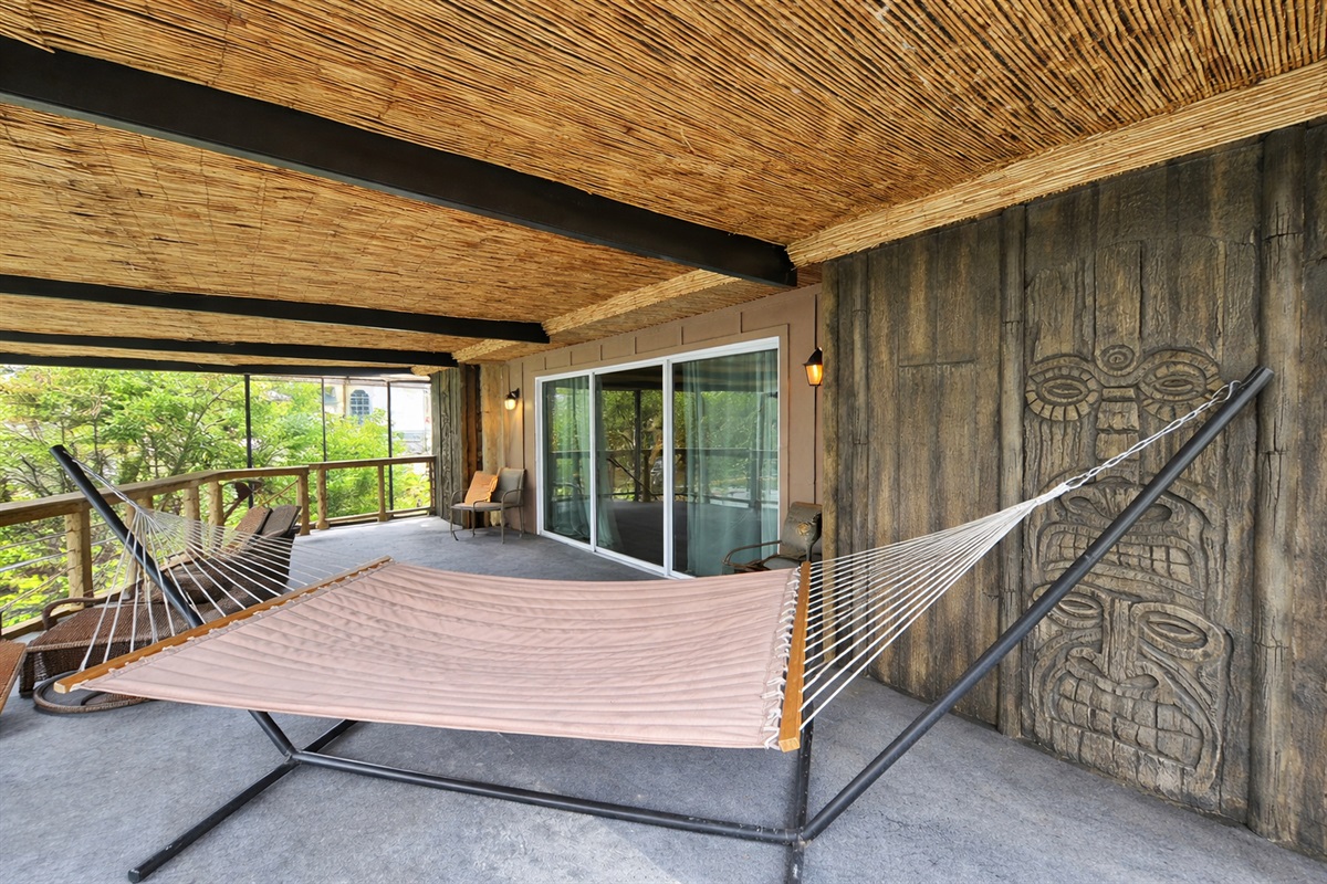 Sway in the hammock on the tiki-carved screened balcony.