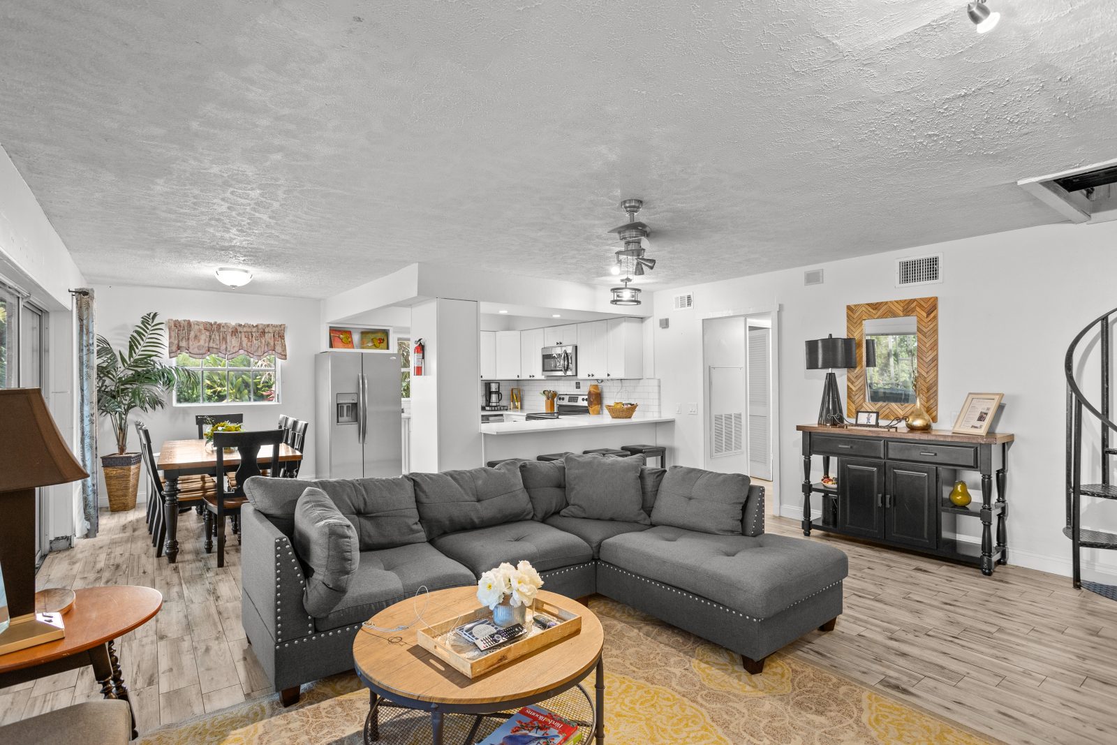 Spread out in a sunlit open living, dining and kitchen.