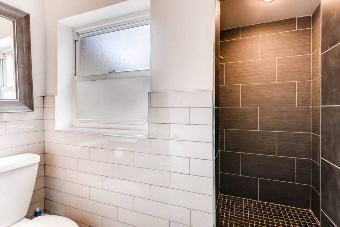 Step into a sleek walk-in tiled shower