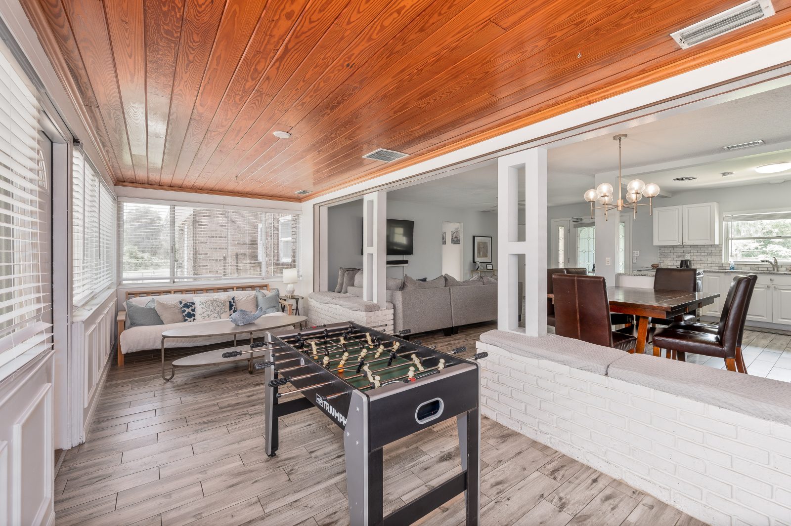 Foosball and lounging under a warm wood ceiling