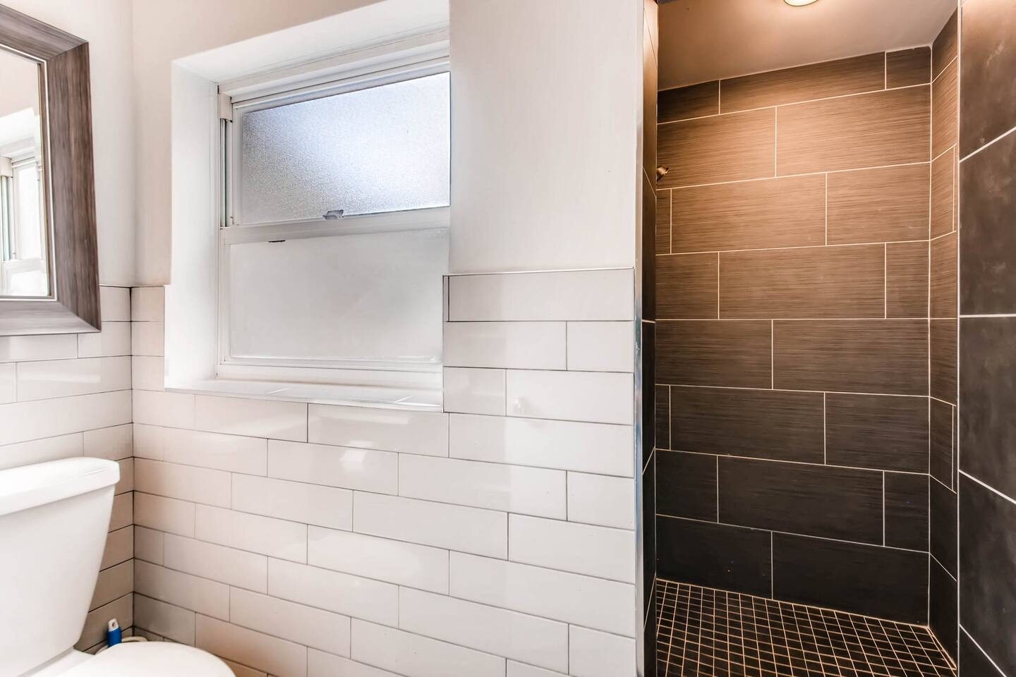 Rinse off the day in the sleek tiled shower