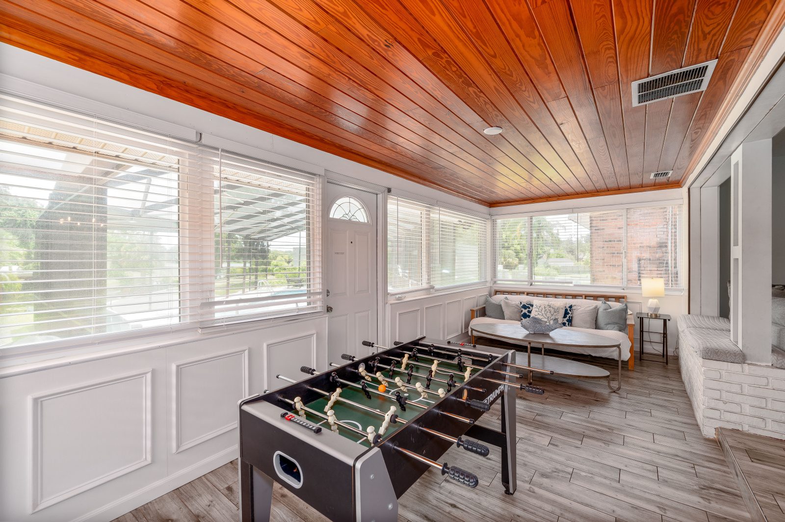 Foosball showdowns under a warm cedar ceiling