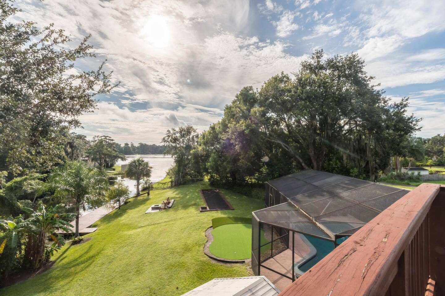 Endless lawn rolling down to the lake.