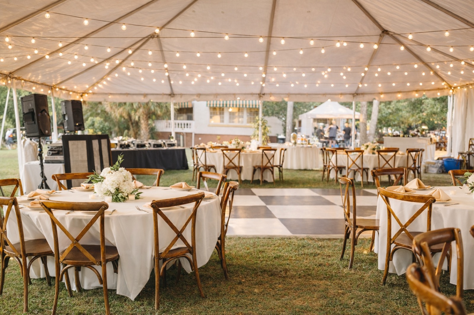 Tented reception with market lights at Lake Lucy Estate