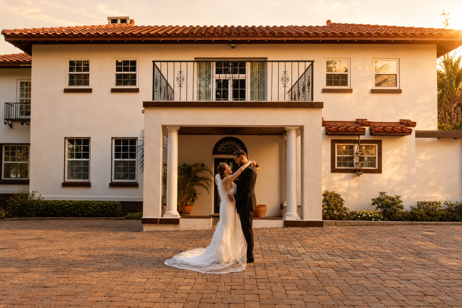 Golden-hour couple in front of the estate at Lake Lucy Estate