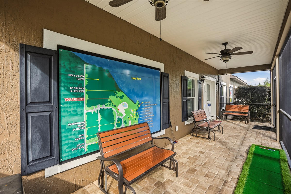 The covered porch with an outdoor TV.