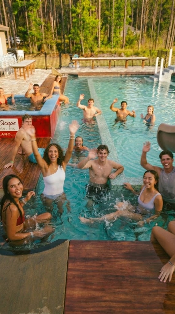 Waving from the pool and the chalk cube hot tub.