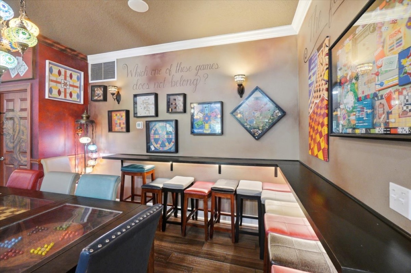 The dining table and game wall.