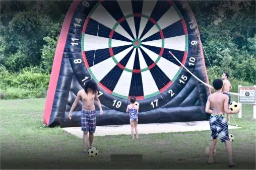 Taking aim at the 15 foot dartboard.