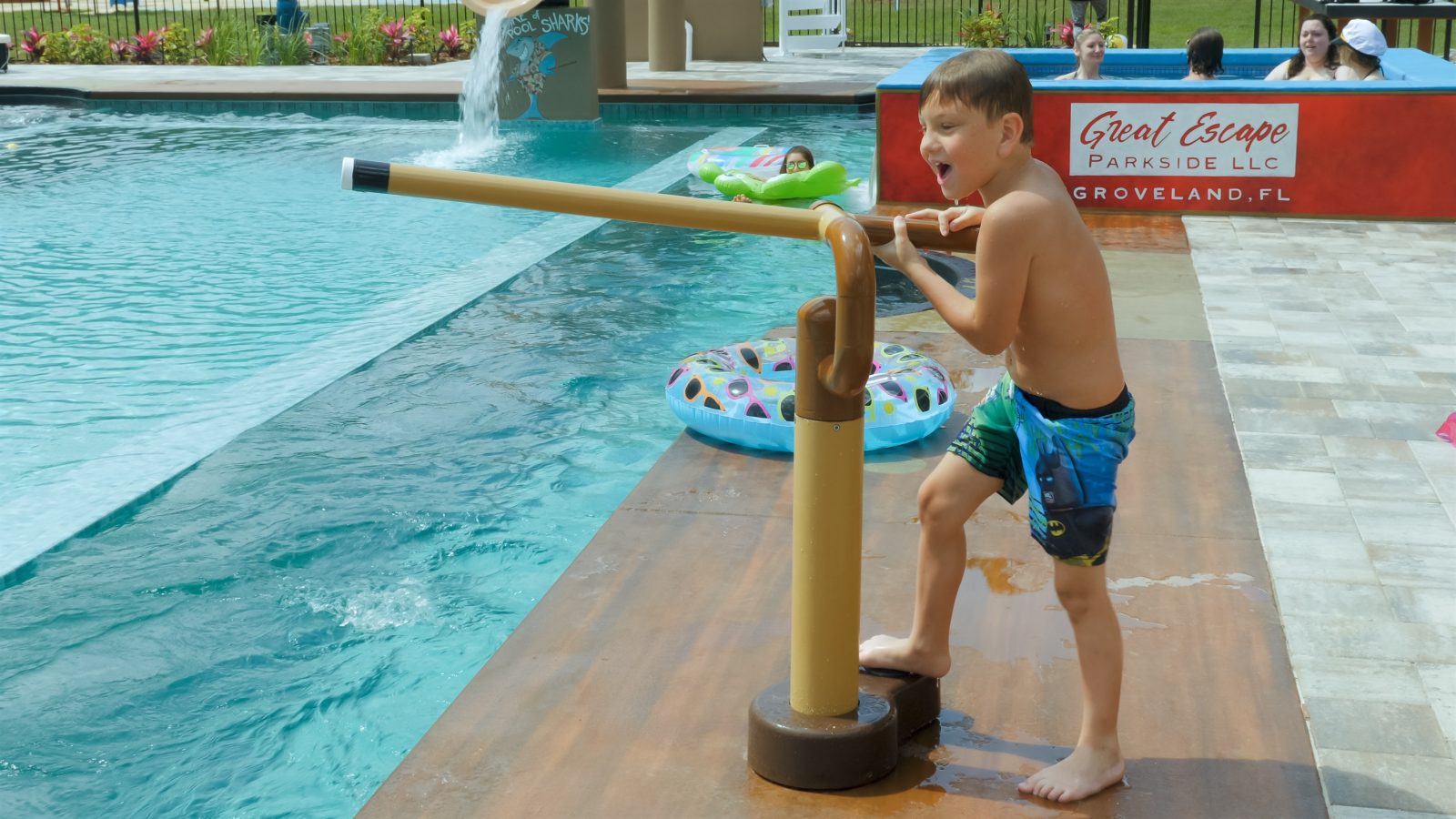 "cue stick" game in the pool area.